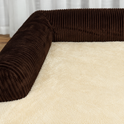 Close view of coffee corduroy bolsters and cream sleeping surface